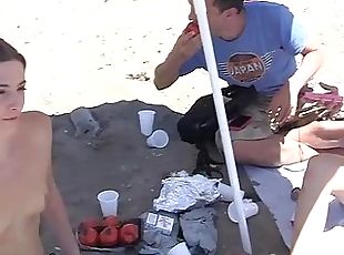 Wild college students fucking on a public beach