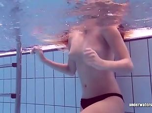 Bikini teen takes off her top in the pool